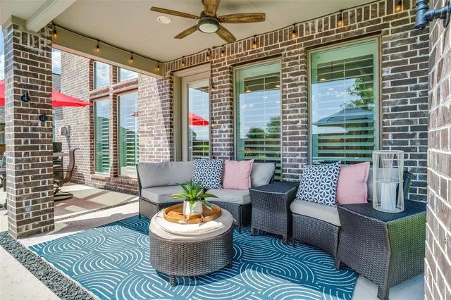 a outdoor living space with patio furniture and a potted plant