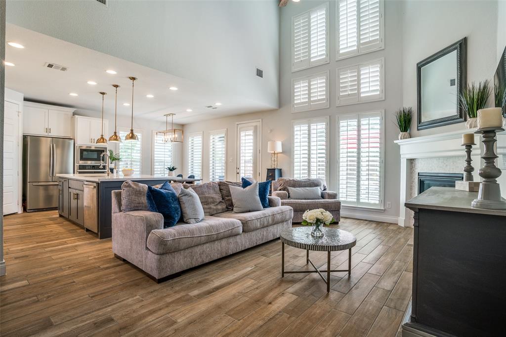 880 Manchester Avenue Prosper, TX 75078 - Photo 5 of 26 a living room with furniture kitchen view and a large window
