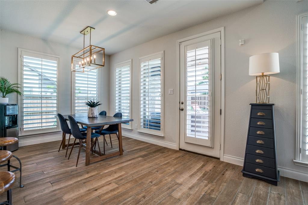 880 Manchester Avenue Prosper, TX 75078 - Photo 9 of 26 a view of a dining room with furniture and wooden floor