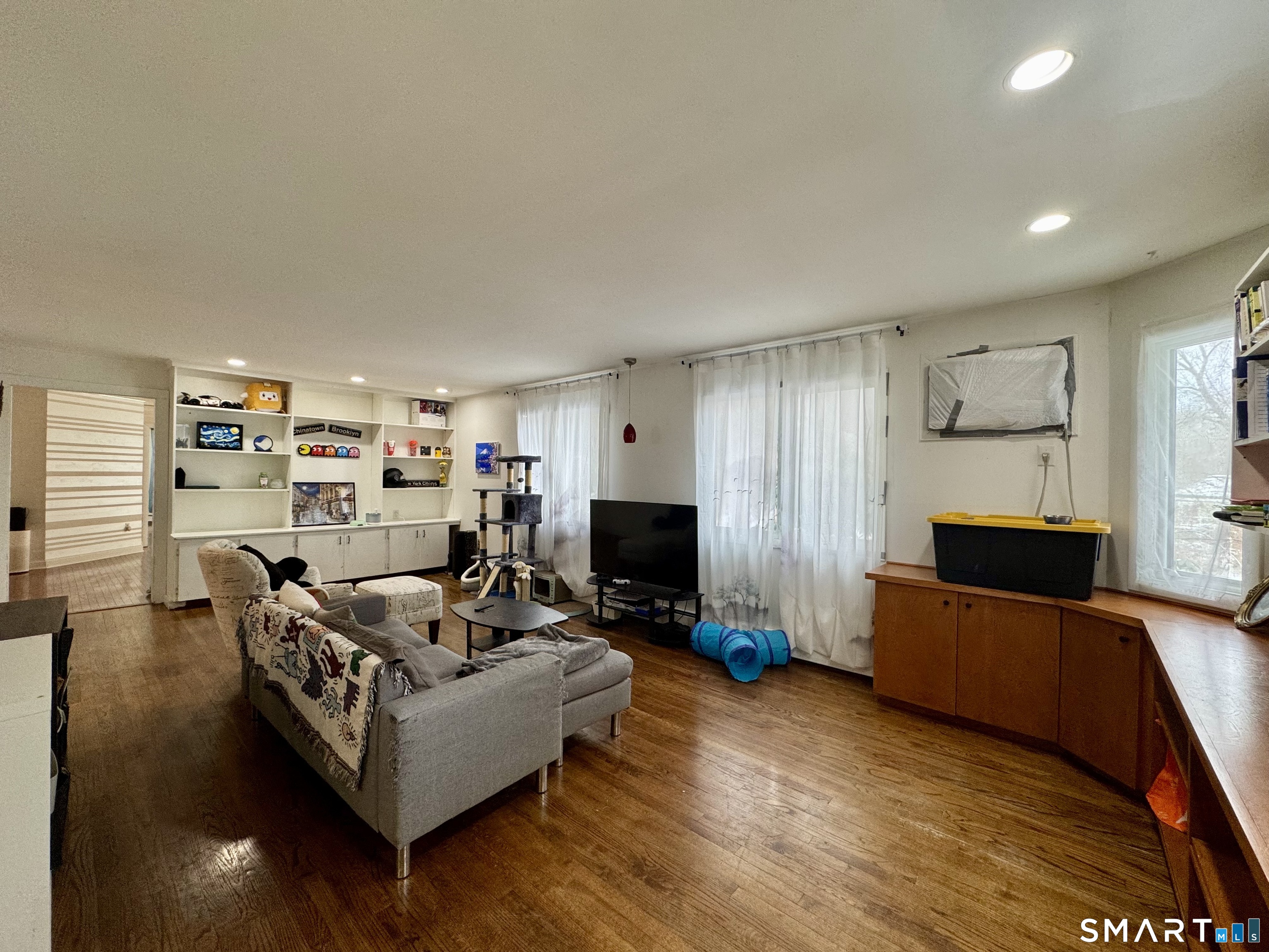 25 Coachman Pike Ledyard, CT 06339 - Photo 23 of 37 a living room with furniture and a flat screen tv