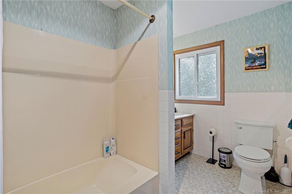 25 Coachman Pike Ledyard, CT 06339 - Photo 24 of 37 a bathroom with a sink a toilet and a shower