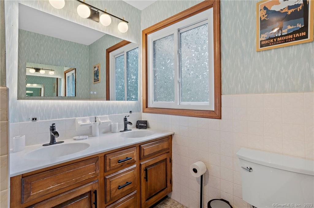 25 Coachman Pike Ledyard, CT 06339 - Photo 26 of 37 a bathroom with a sink and a mirror