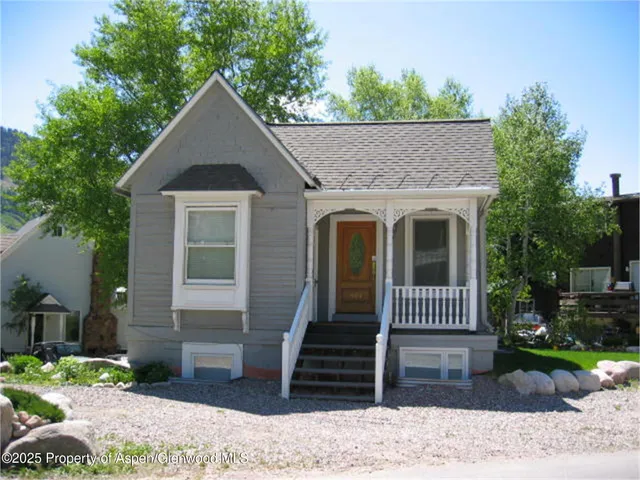 a front view of a house with garage
