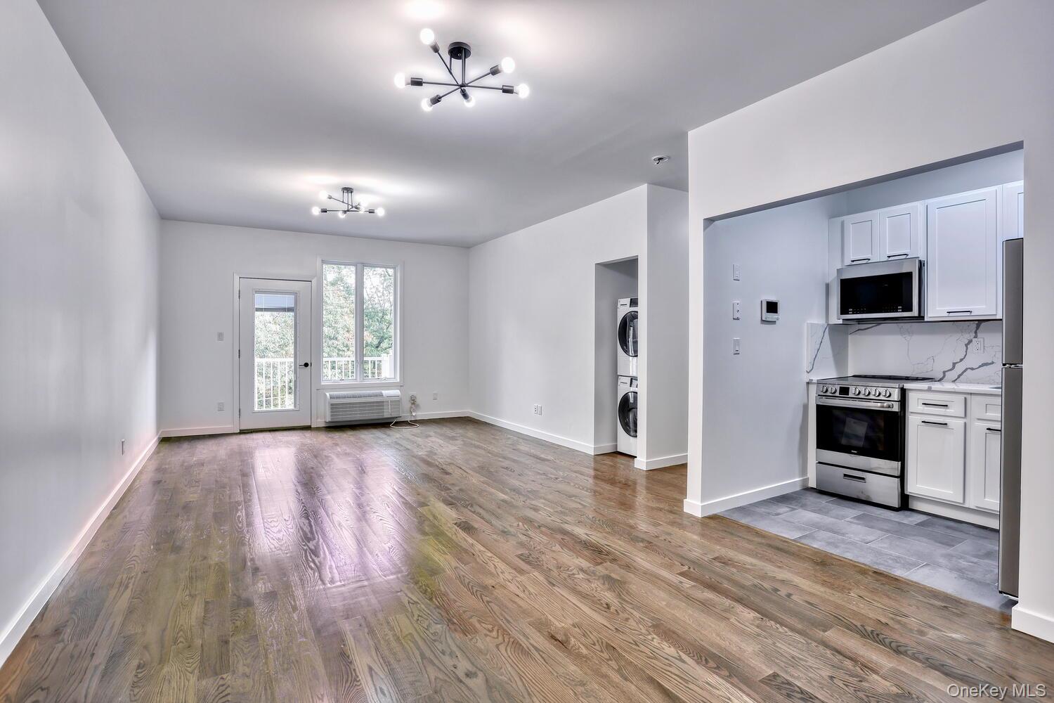 962 Rte 9W, Unit 305 Congers, NY 10920 - Photo 8 of 24 The Kitchen is tucked in its own area, and you get your own stacked washer and dryer.