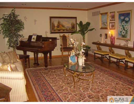 3 Maher Road Somerset, NJ 08873 - Photo 3 of 8 a living room with furniture and wooden floor