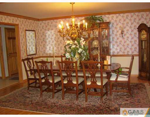 3 Maher Road Somerset, NJ 08873 - Photo 4 of 8 a view of a dining room with furniture and chandelier