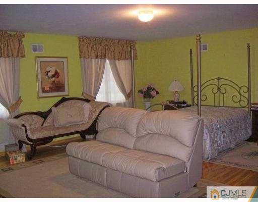 3 Maher Road Somerset, NJ 08873 - Photo 7 of 8 a living room with furniture and a couch