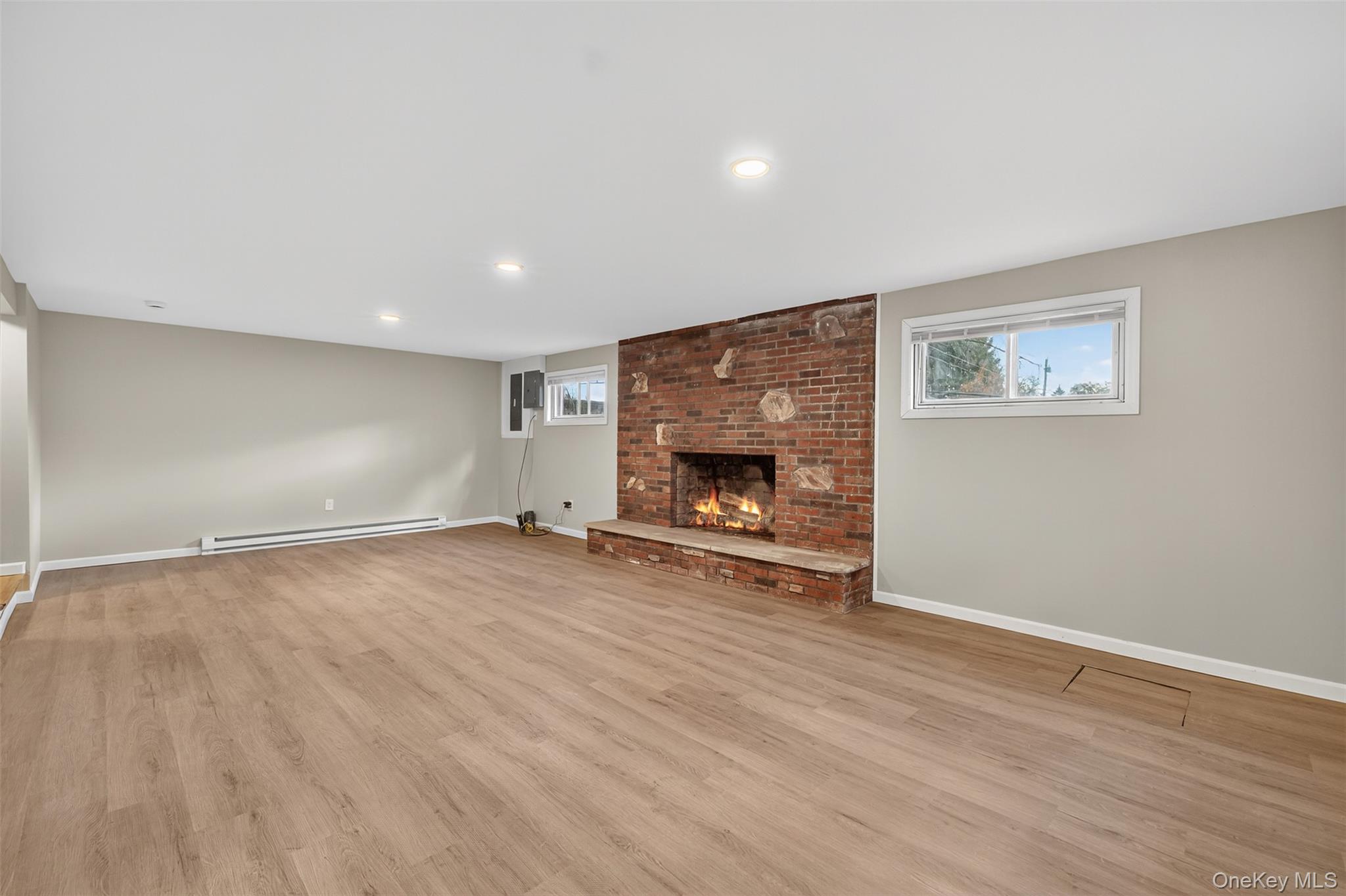 34 Round Hill Road Walden, NY 12586 - Photo 15 of 18 an empty room with wooden floor fireplace and a window