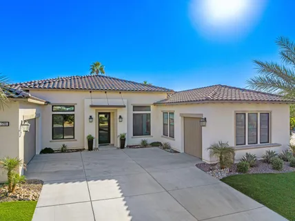a living room with fireplace furniture and a flat screen tv