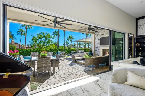 a view of a chairs and table in a patio