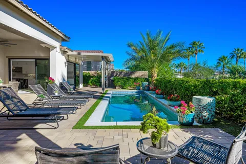 a large kitchen with a table and chairs