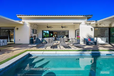 a view of a dining room with furniture wooden floor and chandelier