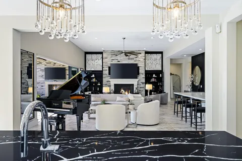 a bathroom with a double vanity sink toilet mirror and shower