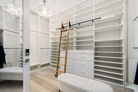 an aerial view of residential houses with outdoor space and street view