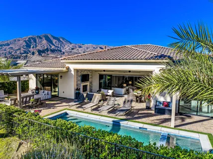 a view of a chairs and table in a patio