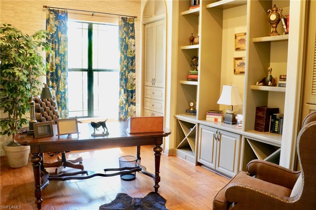 4231 Pine Ridge Road Naples, FL 34119 - Photo 8 of 18 a room with furniture a rug and a window