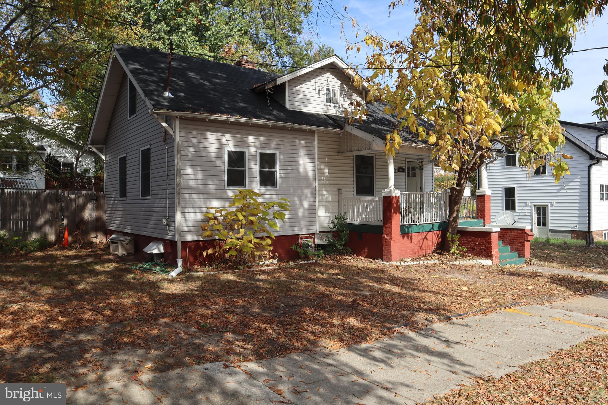 1004 Shepherd Street Northeast Washington, DC 20017 - Photo 2 of 28 a view of a house with a yard patio and a tree