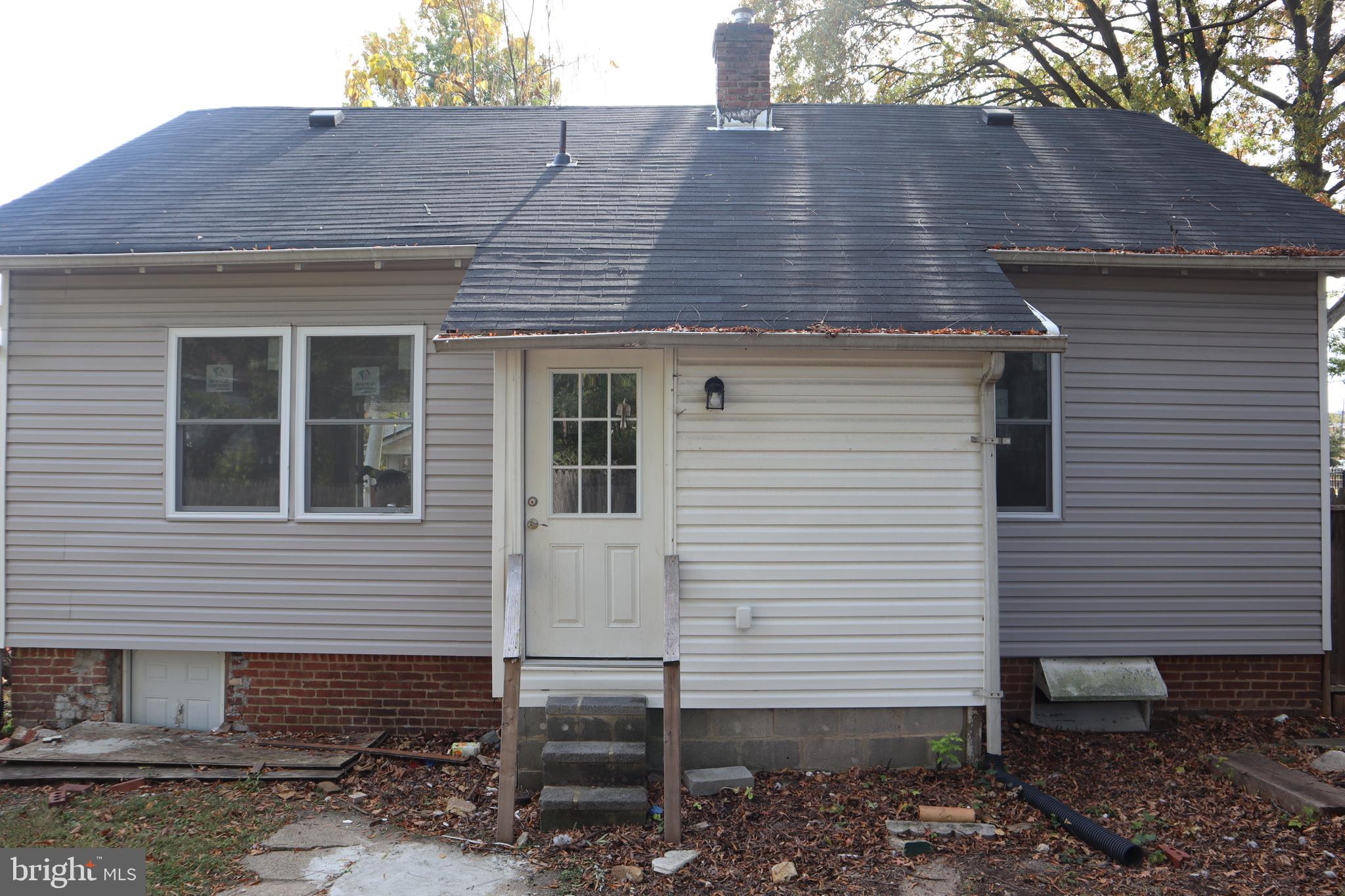 1004 Shepherd Street Northeast Washington, DC 20017 - Photo 6 of 28 a front view of a house with garden