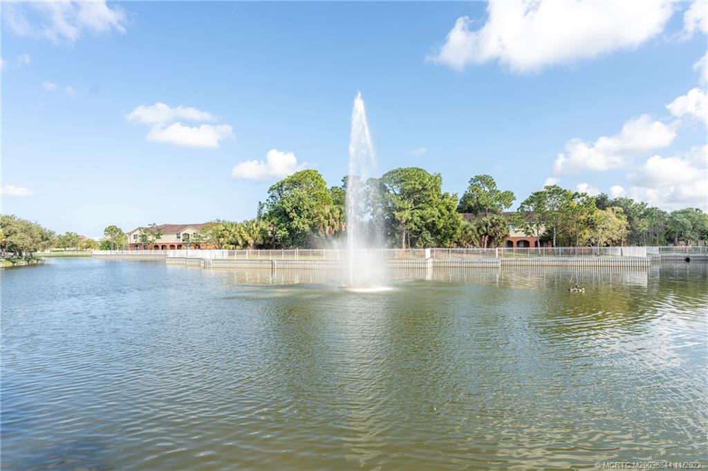 55 Southeast Palermo, Unit 203 Stuart, FL 34994 - Photo 7 of 10 a view of water pond with yard and lake view