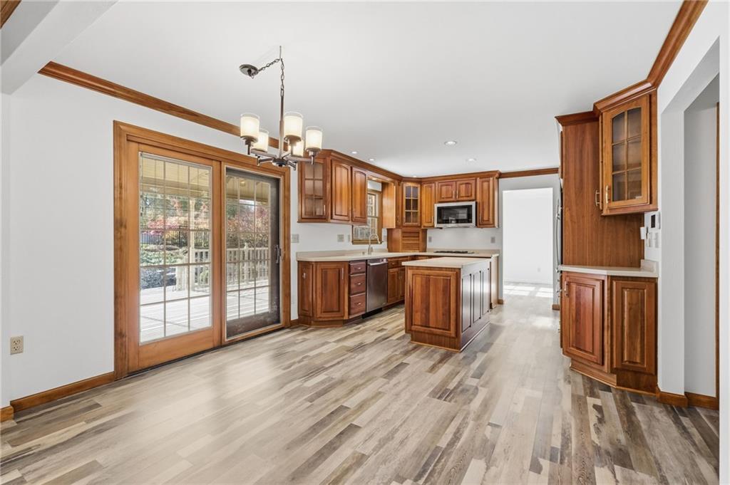 120 Timothy Road Gibsonia, PA 15044 - Photo 13 of 50 a kitchen with stainless steel appliances a refrigerator and wooden floor