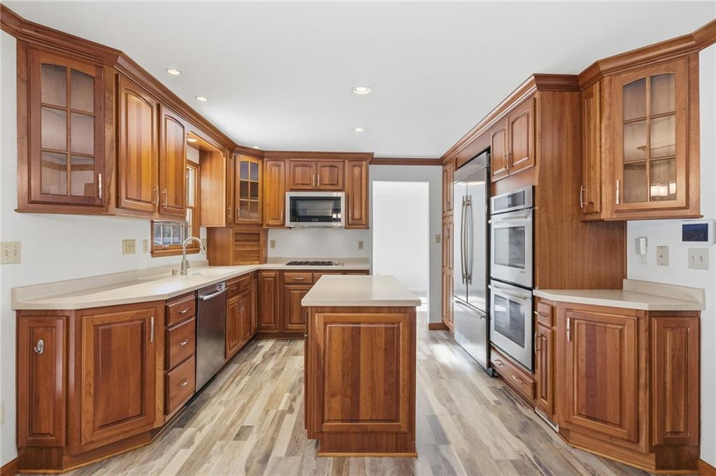120 Timothy Road Gibsonia, PA 15044 - Photo 14 of 50 a kitchen with stainless steel appliances granite countertop a stove a sink dishwasher and a refrigerator
