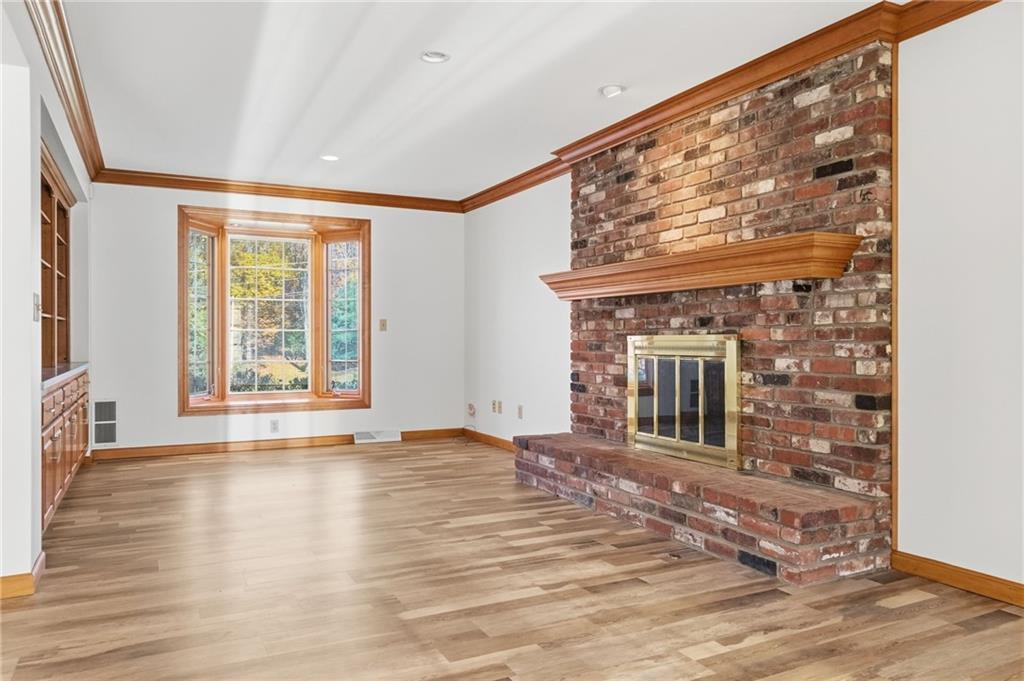 120 Timothy Road Gibsonia, PA 15044 - Photo 20 of 50 a view of an empty room with wooden floor and a window
