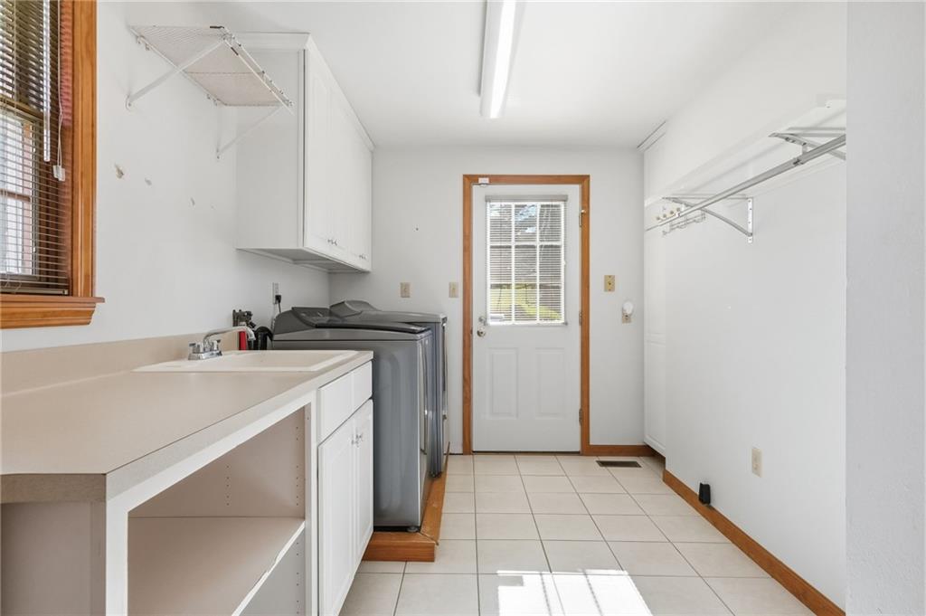 120 Timothy Road Gibsonia, PA 15044 - Photo 26 of 50 a utility room with cabinets washer and dryer