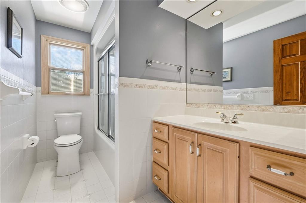 120 Timothy Road Gibsonia, PA 15044 - Photo 34 of 50 a bathroom with a granite countertop sink toilet and mirror