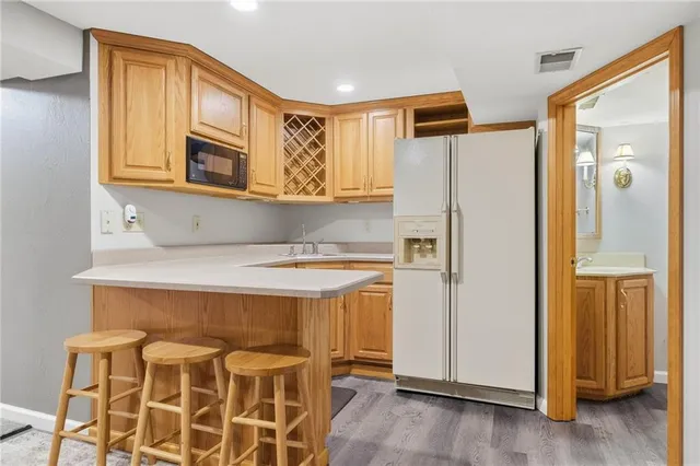 a kitchen with stainless steel appliances a refrigerator and a stove