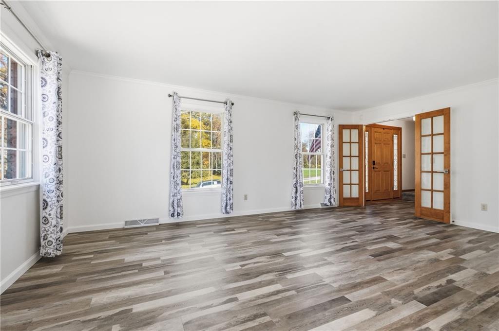 120 Timothy Road Gibsonia, PA 15044 - Photo 10 of 50 a view of an empty room with window and wooden floor