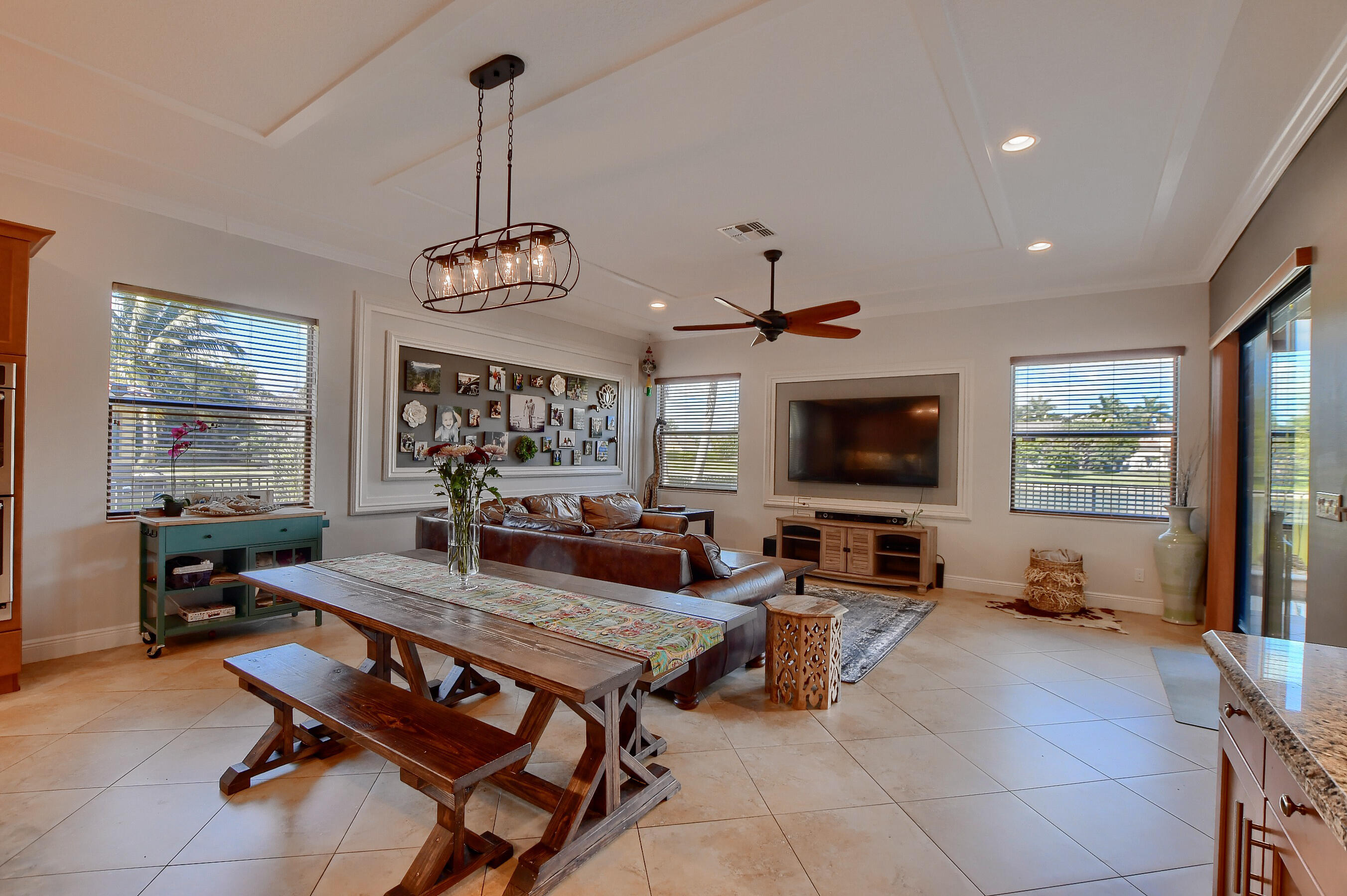 12161 Boca Reserve Lane Boca Raton, FL 33428 - Photo 14 of 53 a living room with furniture a flat screen tv and a large window