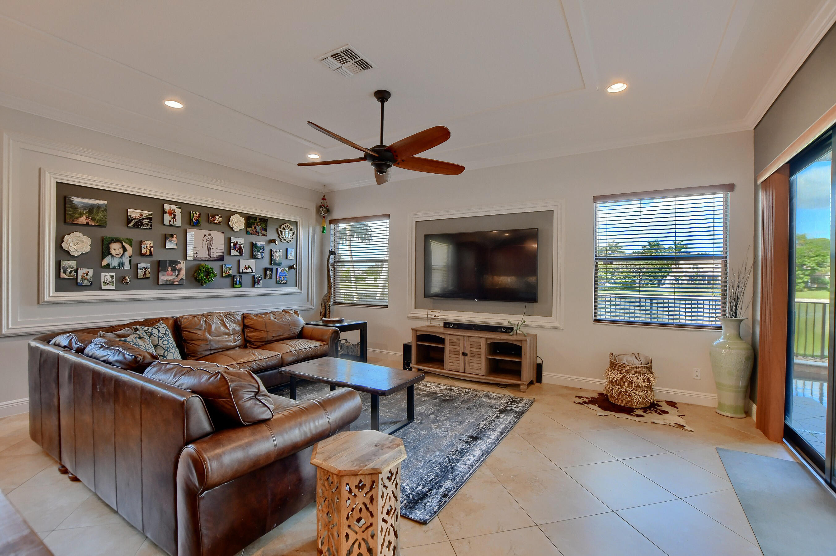 12161 Boca Reserve Lane Boca Raton, FL 33428 - Photo 16 of 53 a living room with furniture and a flat screen tv