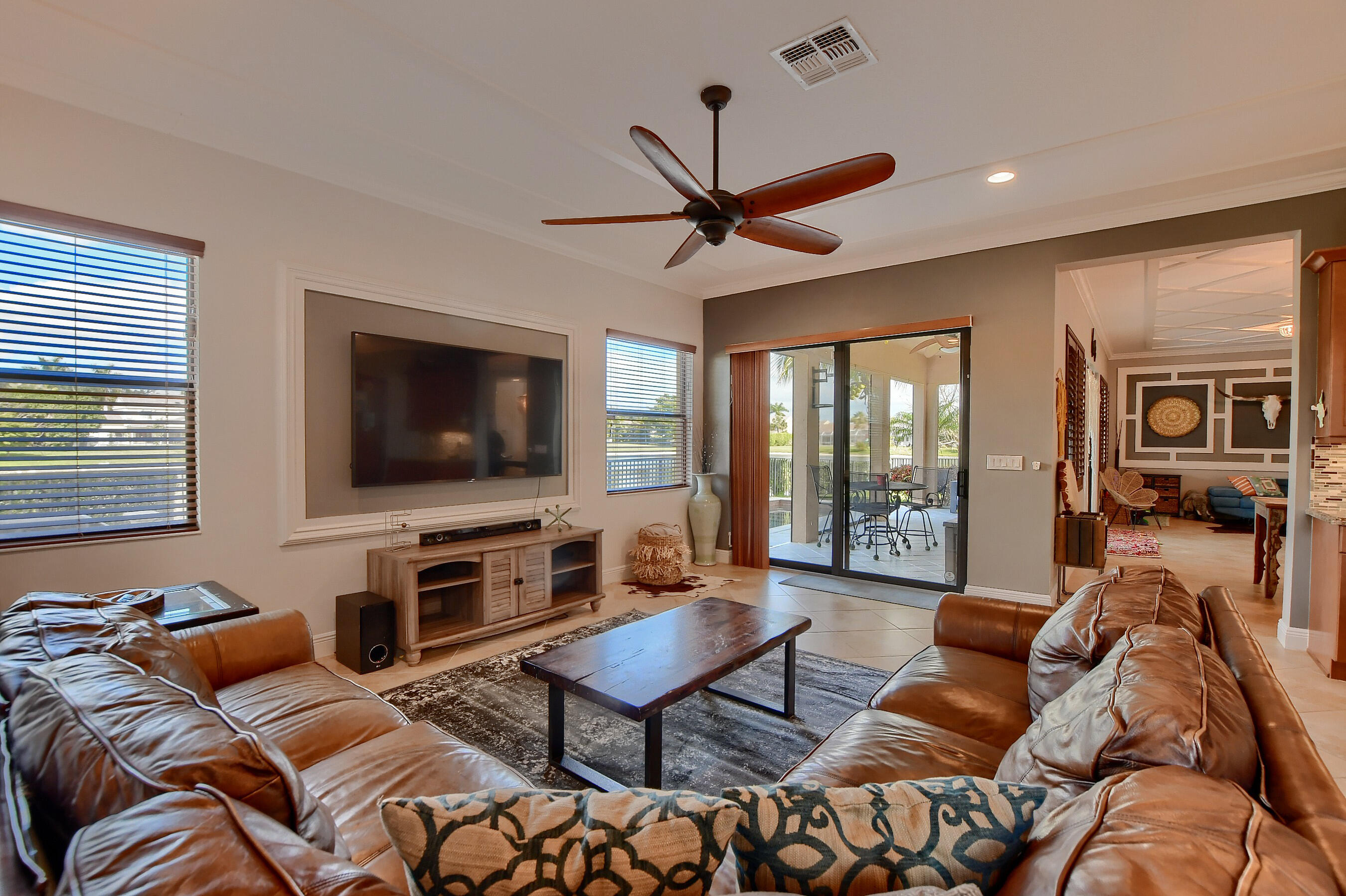 12161 Boca Reserve Lane Boca Raton, FL 33428 - Photo 17 of 53 a living room with furniture and a flat screen tv