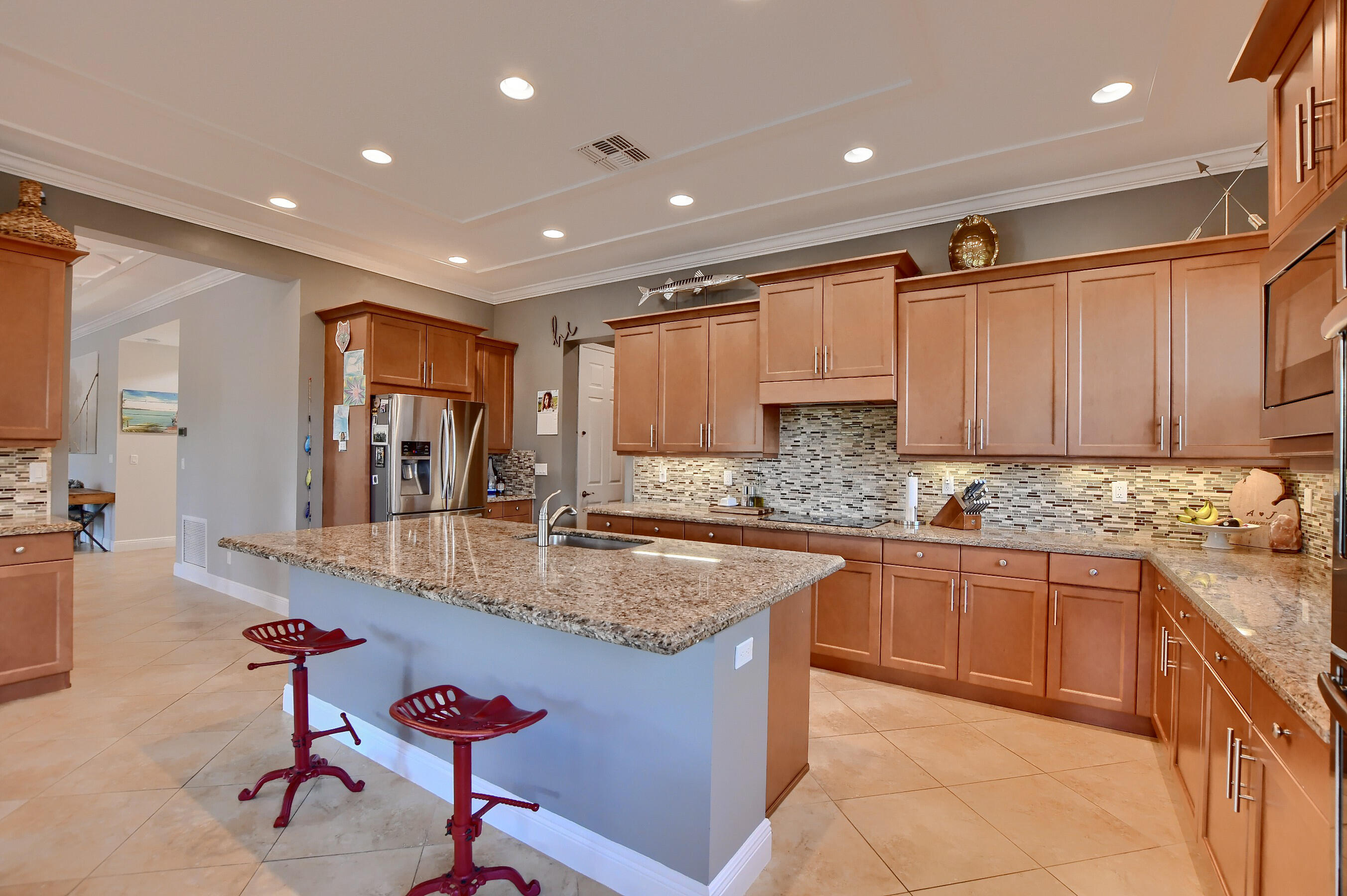 12161 Boca Reserve Lane Boca Raton, FL 33428 - Photo 26 of 53 a large kitchen with granite countertop lots of counter top space