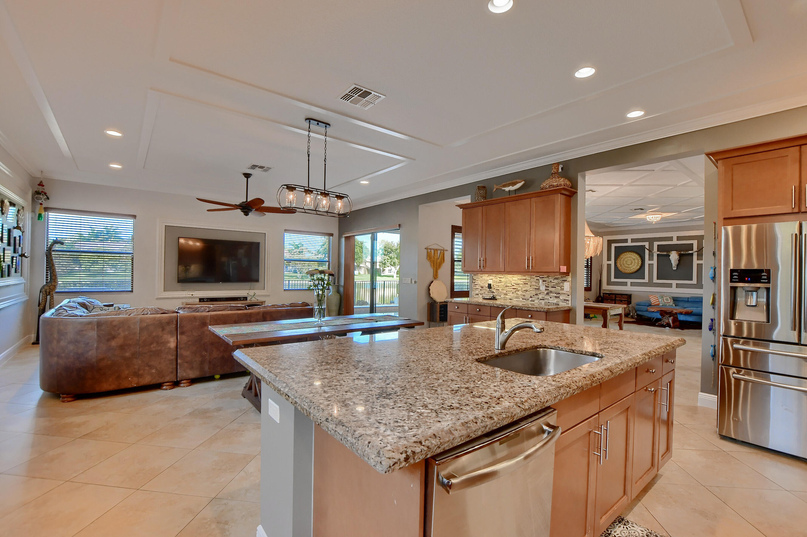 12161 Boca Reserve Lane Boca Raton, FL 33428 - Photo 28 of 53 a kitchen with stainless steel appliances granite countertop a sink and a refrigerator