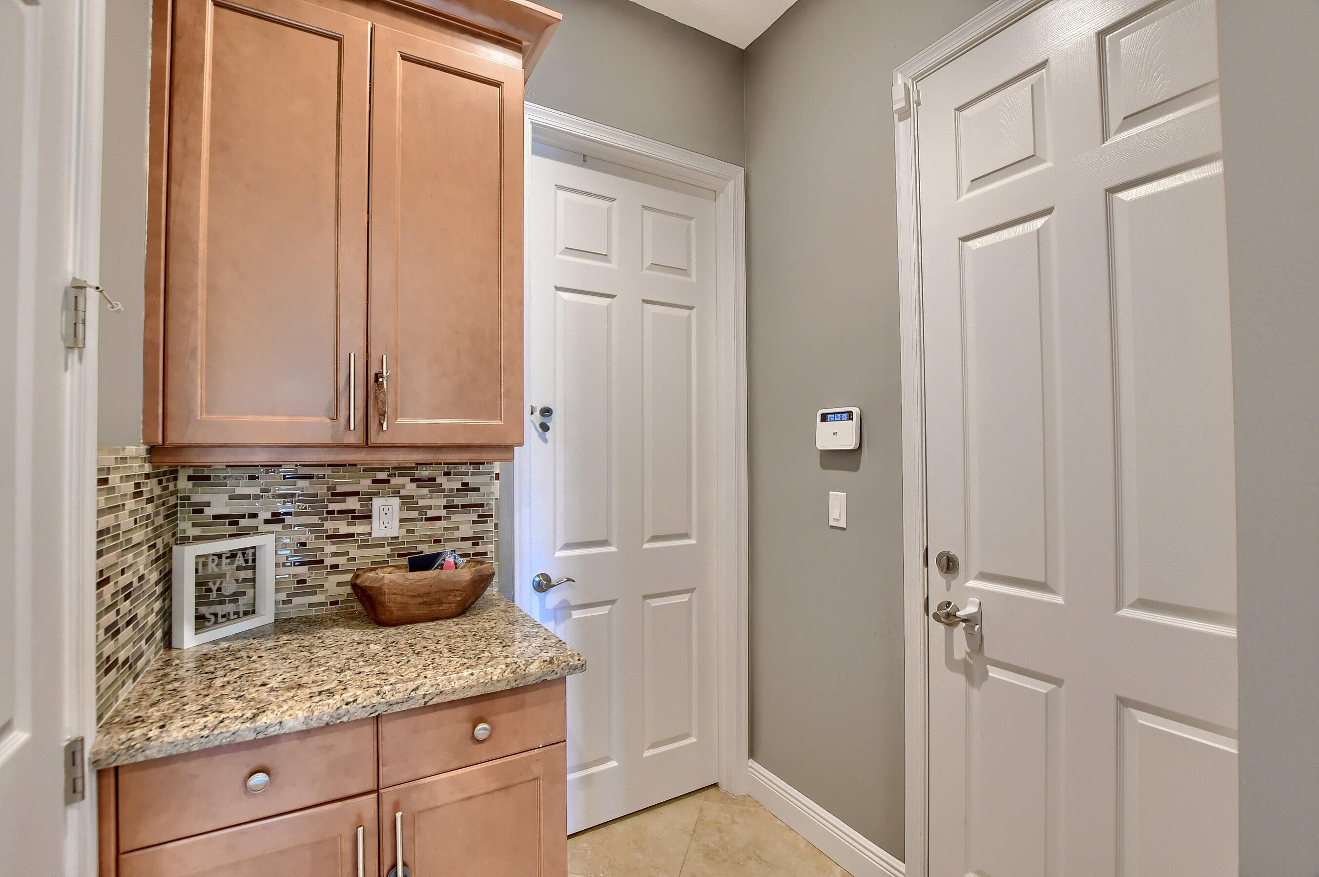 12161 Boca Reserve Lane Boca Raton, FL 33428 - Photo 31 of 53 a bathroom with a granite countertop sink and a mirror