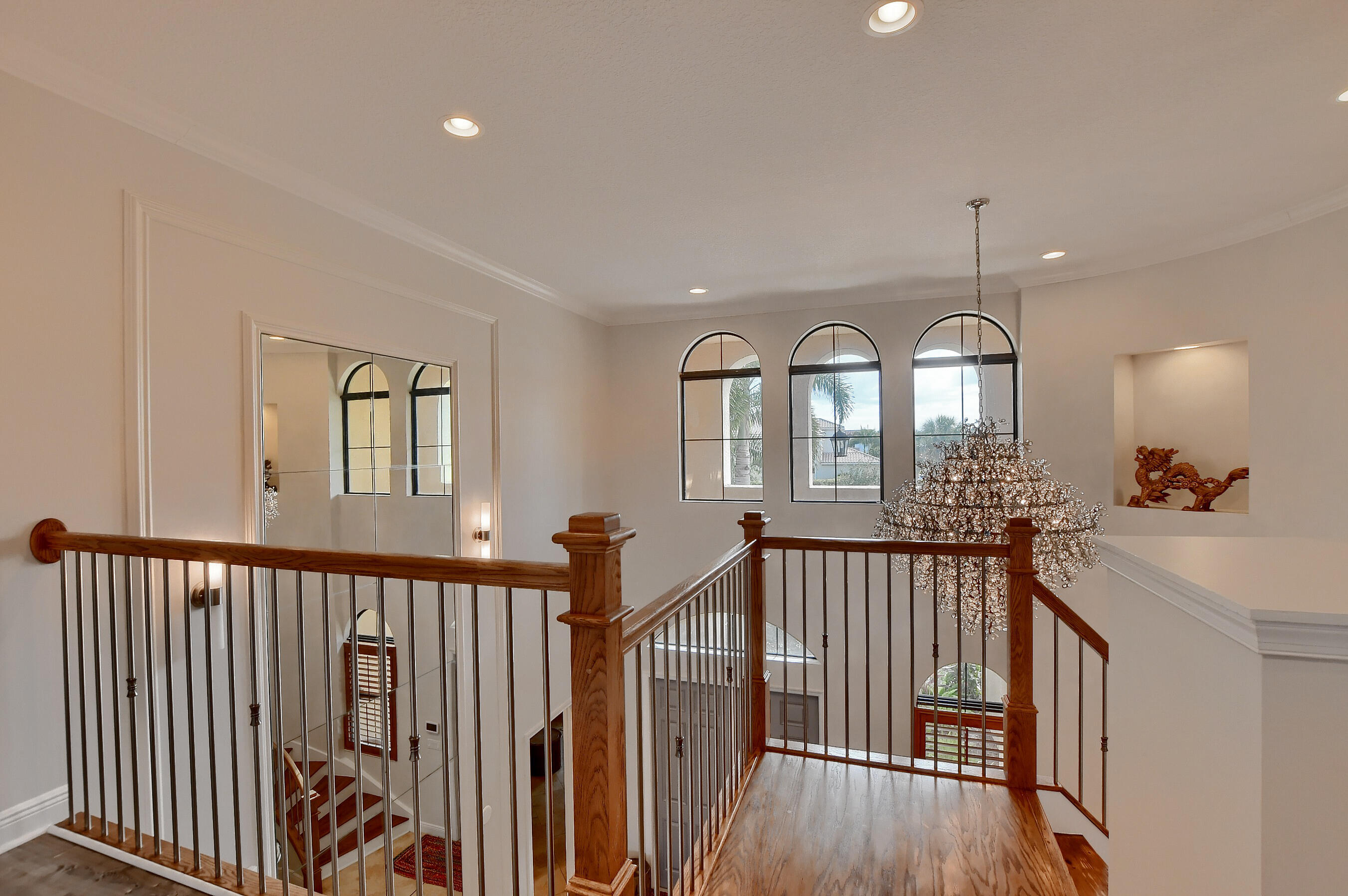 12161 Boca Reserve Lane Boca Raton, FL 33428 - Photo 32 of 53 a view of a hallway with wooden floor and windows