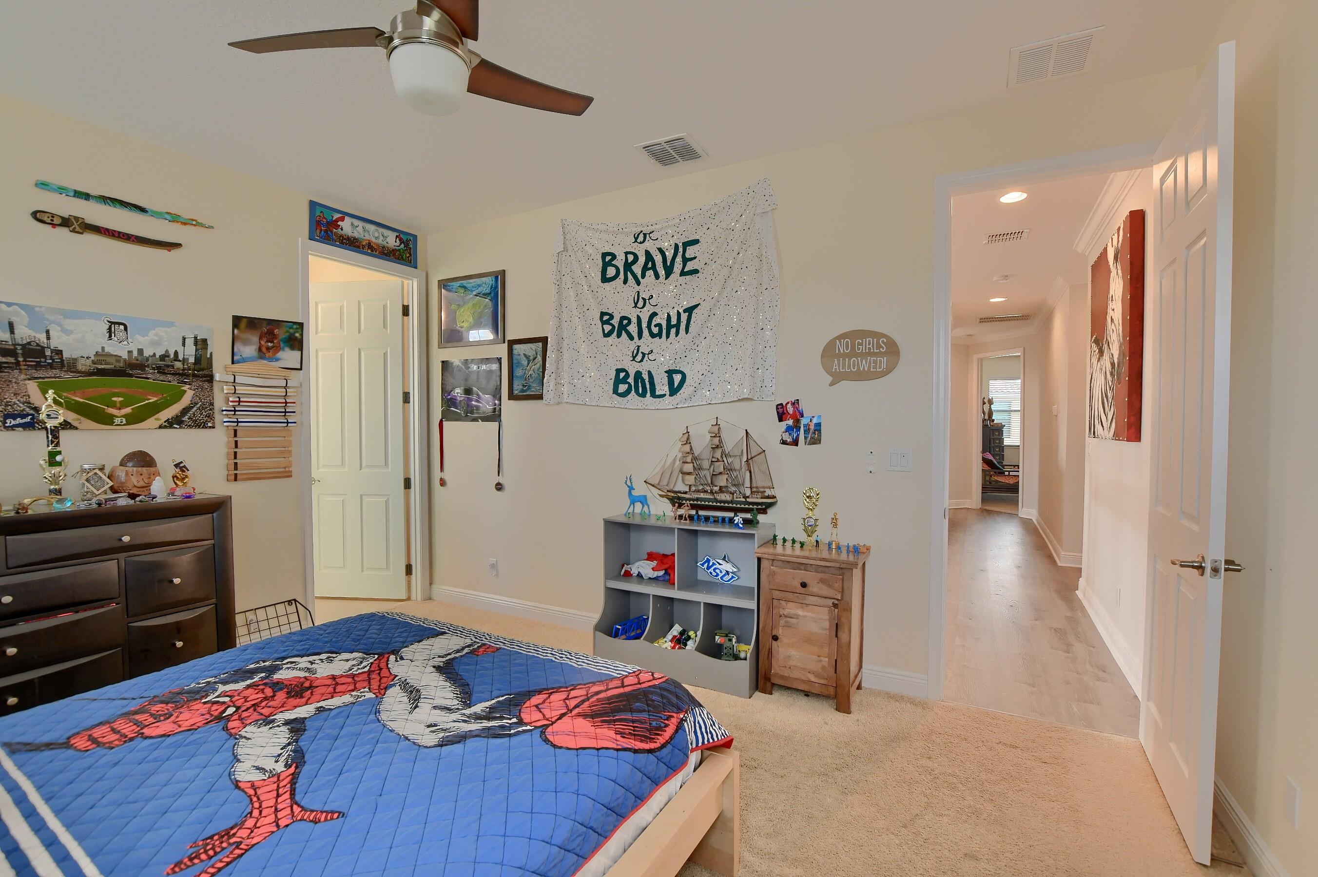 12161 Boca Reserve Lane Boca Raton, FL 33428 - Photo 35 of 53 a bedroom with a bed and furniture