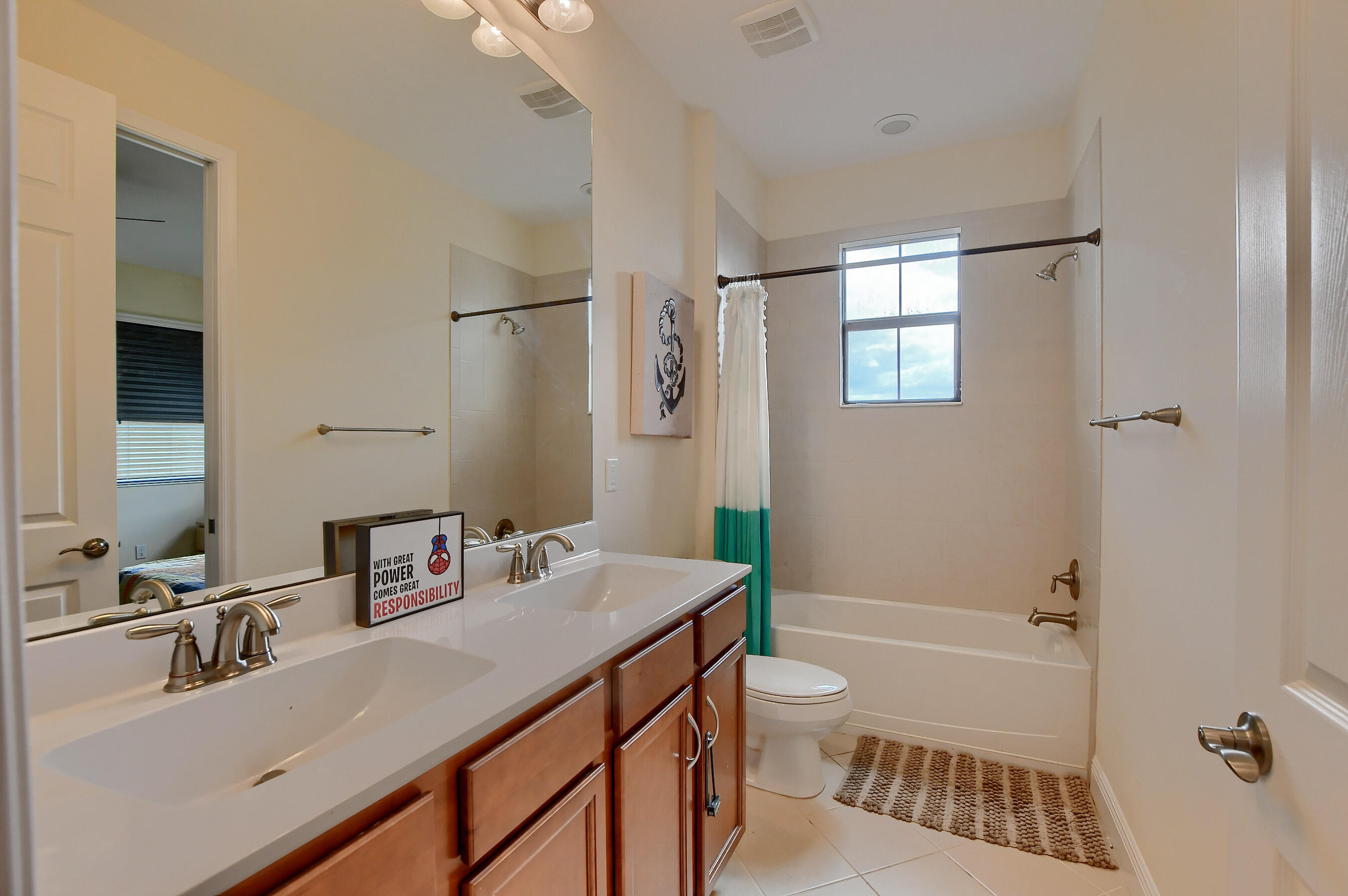 12161 Boca Reserve Lane Boca Raton, FL 33428 - Photo 38 of 53 a bathroom with a sink a toilet and shower