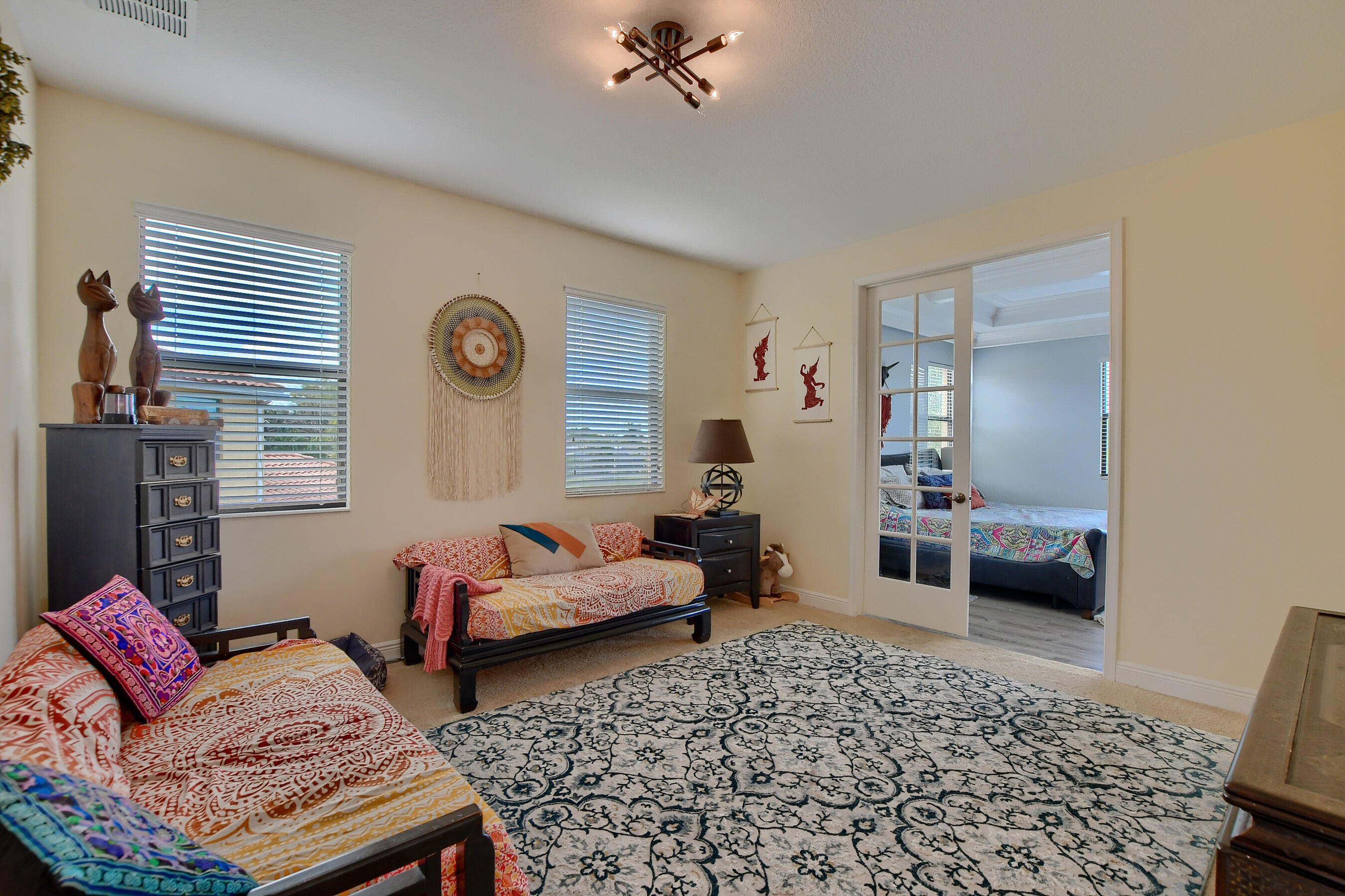 12161 Boca Reserve Lane Boca Raton, FL 33428 - Photo 39 of 53 a living room with furniture and a window