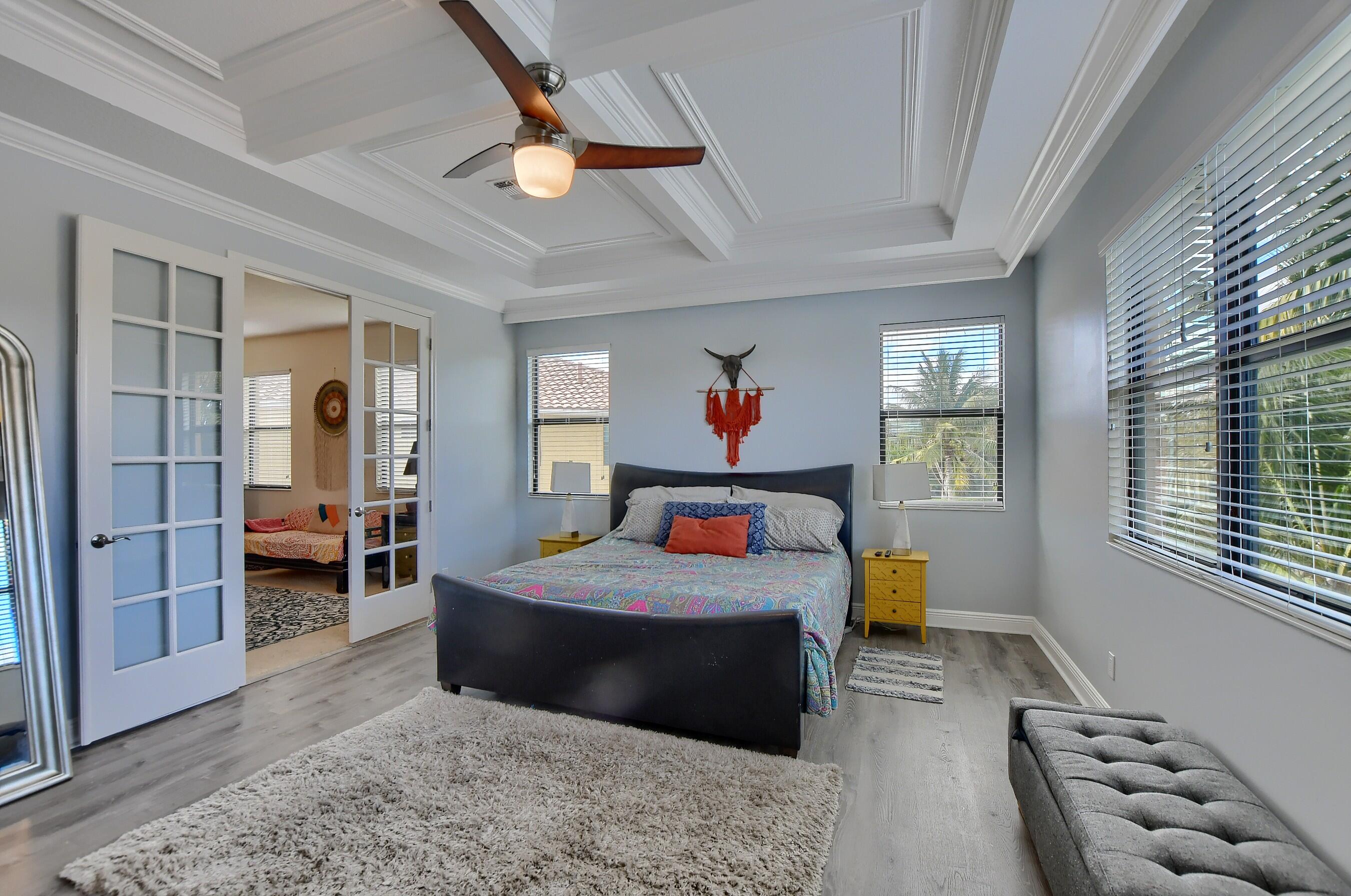 12161 Boca Reserve Lane Boca Raton, FL 33428 - Photo 41 of 53 a bedroom with a bed and a view of living room