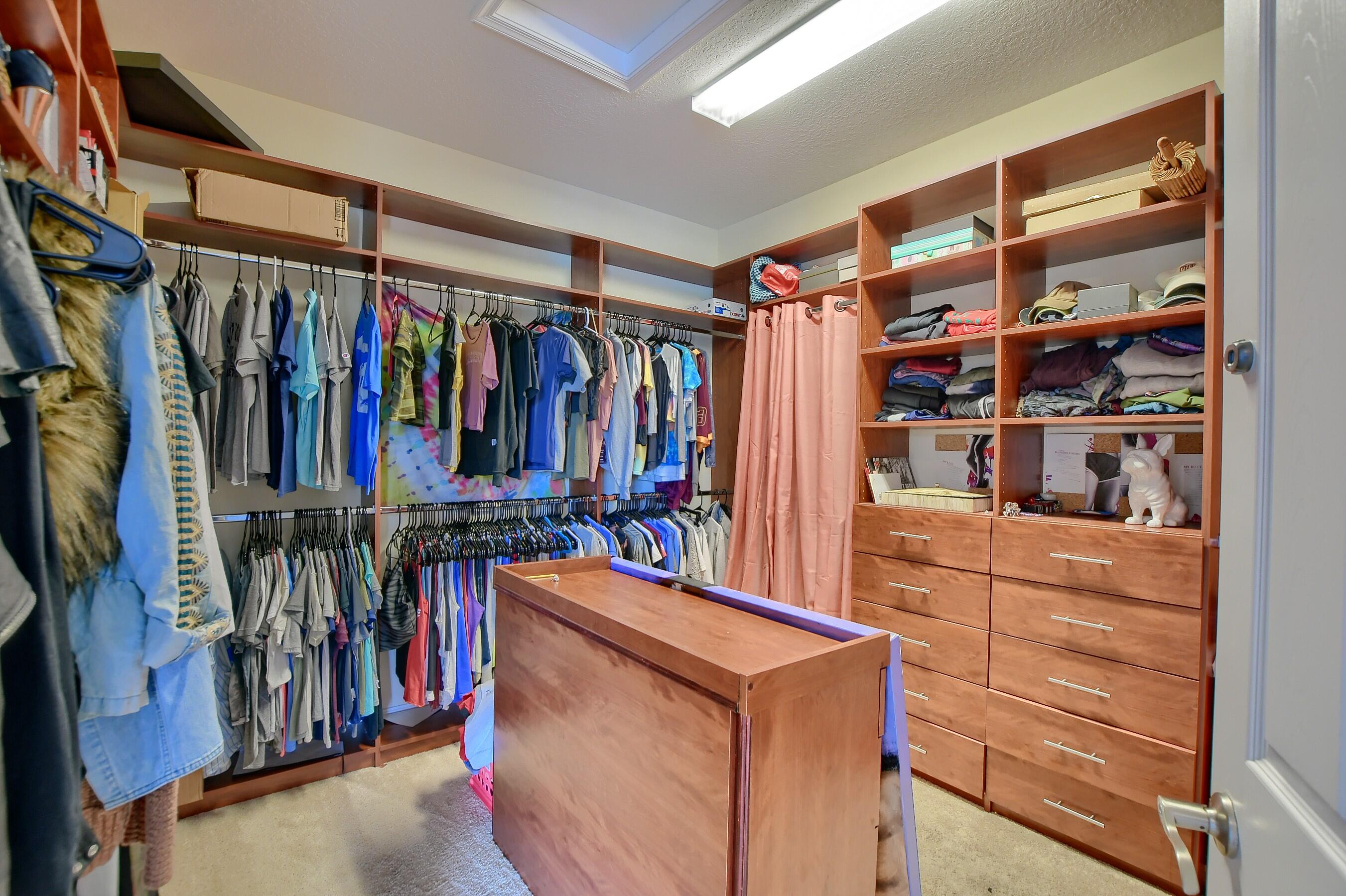 12161 Boca Reserve Lane Boca Raton, FL 33428 - Photo 43 of 53 a view of walk in closet with clothes and shoes