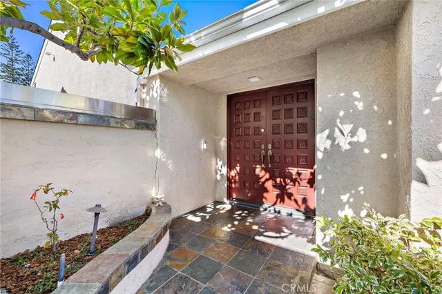 a vase of flowers sitting on a floor