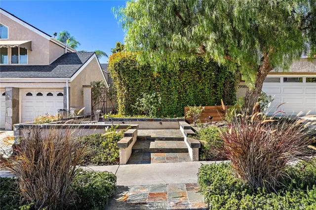 a view of a backyard with sitting area