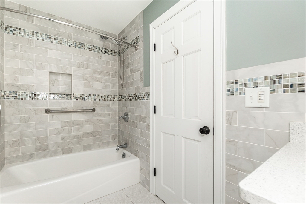 19 Homestead Road Lynnfield, MA 01940 - Photo 11 of 34 a bathroom with a bathtub and a shower