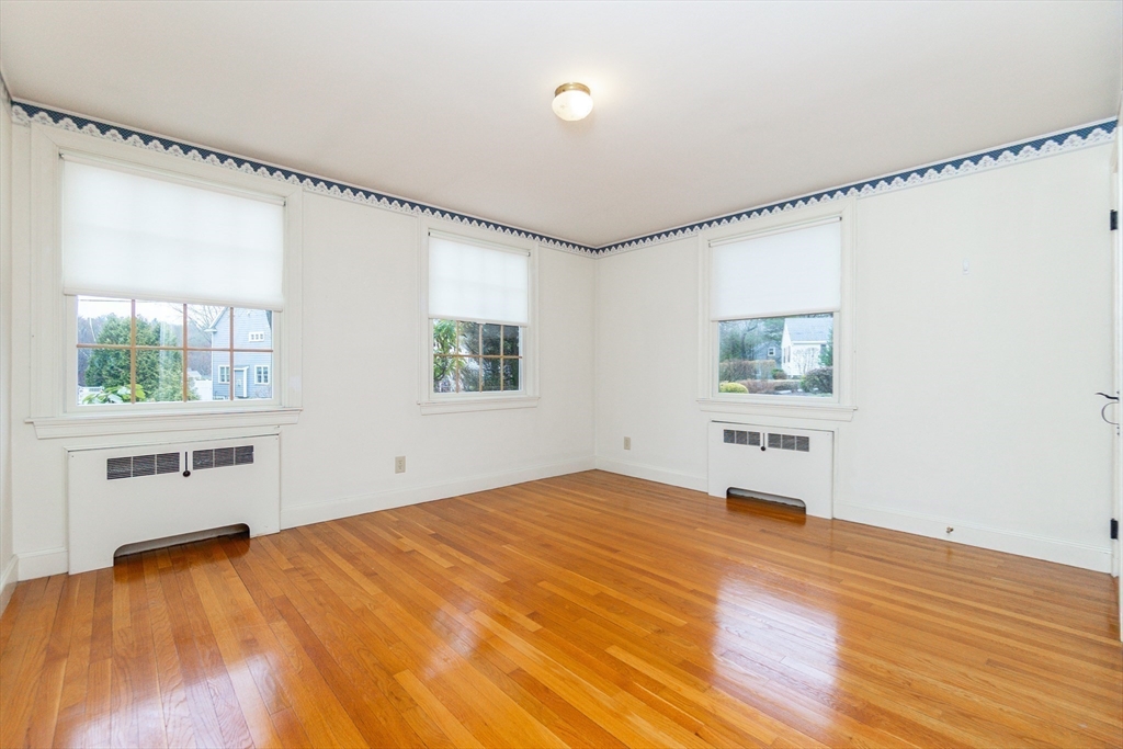 19 Homestead Road Lynnfield, MA 01940 - Photo 12 of 34 a bedroom with a bed and a window