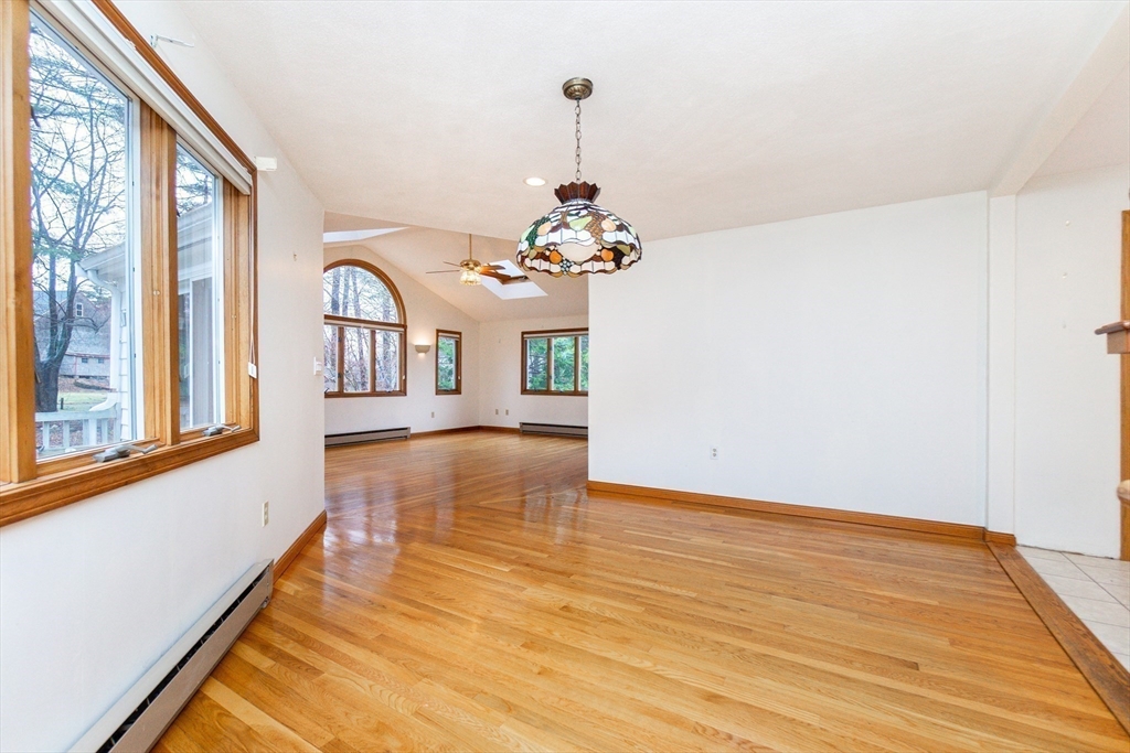 19 Homestead Road Lynnfield, MA 01940 - Photo 17 of 34 a view of a room with wooden floor and chandelier