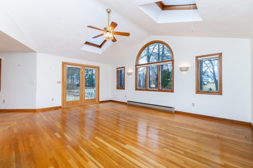 19 Homestead Road Lynnfield, MA 01940 - Photo 20 of 34 a view of an empty room with wooden floor window and a kitchen