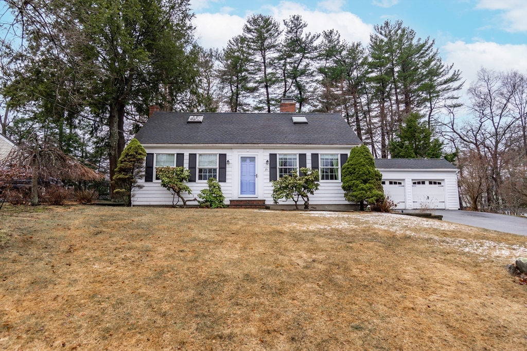 19 Homestead Road Lynnfield, MA 01940 - Photo 2 of 34 a front view of a house with a yard and garage