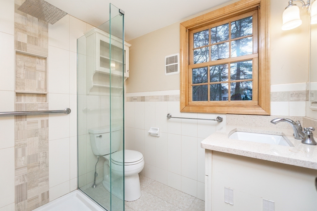 19 Homestead Road Lynnfield, MA 01940 - Photo 21 of 34 a bathroom with a sink toilet and shower